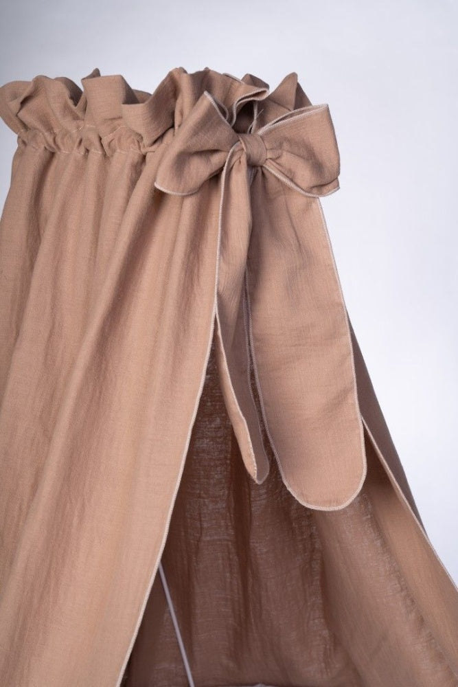 Taupe-colored Stubenwagen canopy with gathered top and tied fabric bow detail. - Mionido - Bollerwagen Tony (natur)